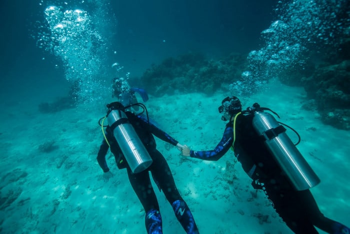 Couple diving in Bora Bora
